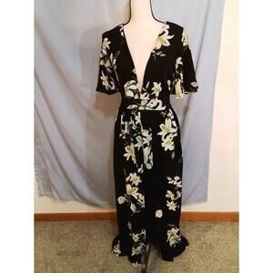 Socialite.  Black and floral romper with open maxi skirt